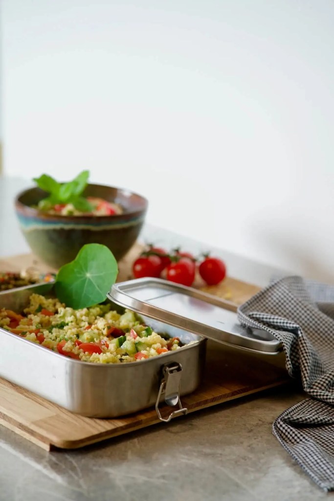 Vegan Bulgur Salad packed in a lunch box with the lid open