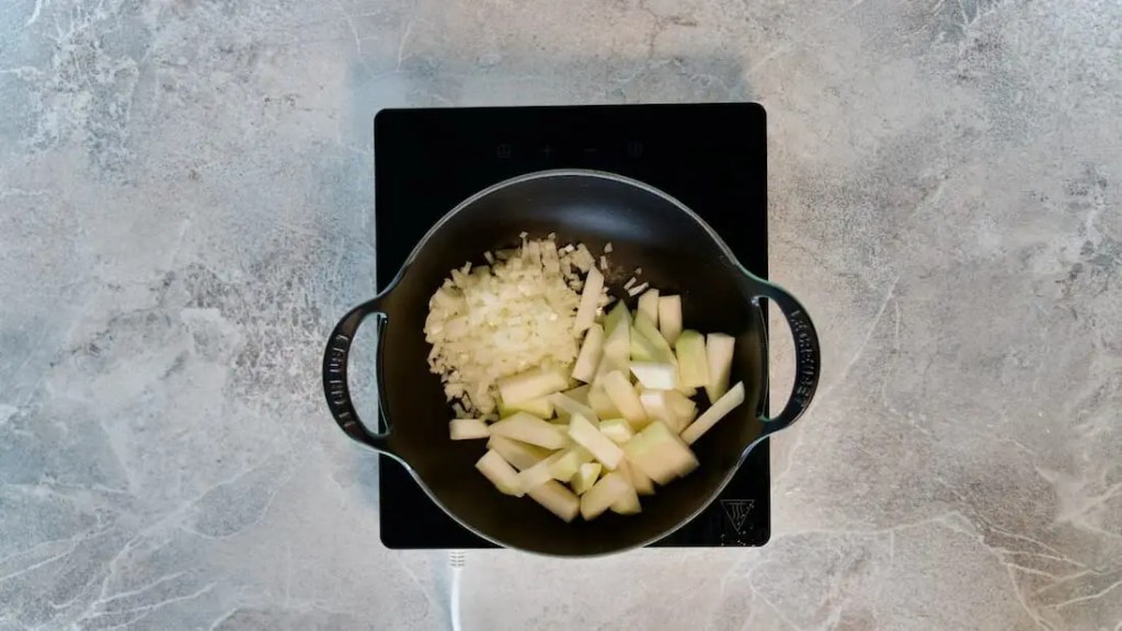Cabbage turnip and onion roasting in a pot