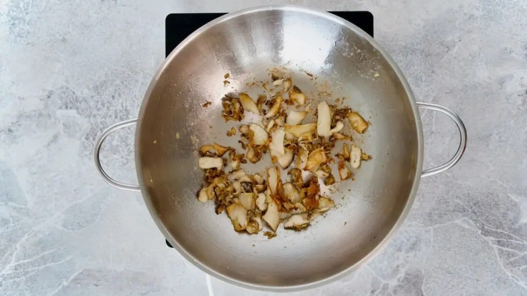 mushrooms being roasted in a pan