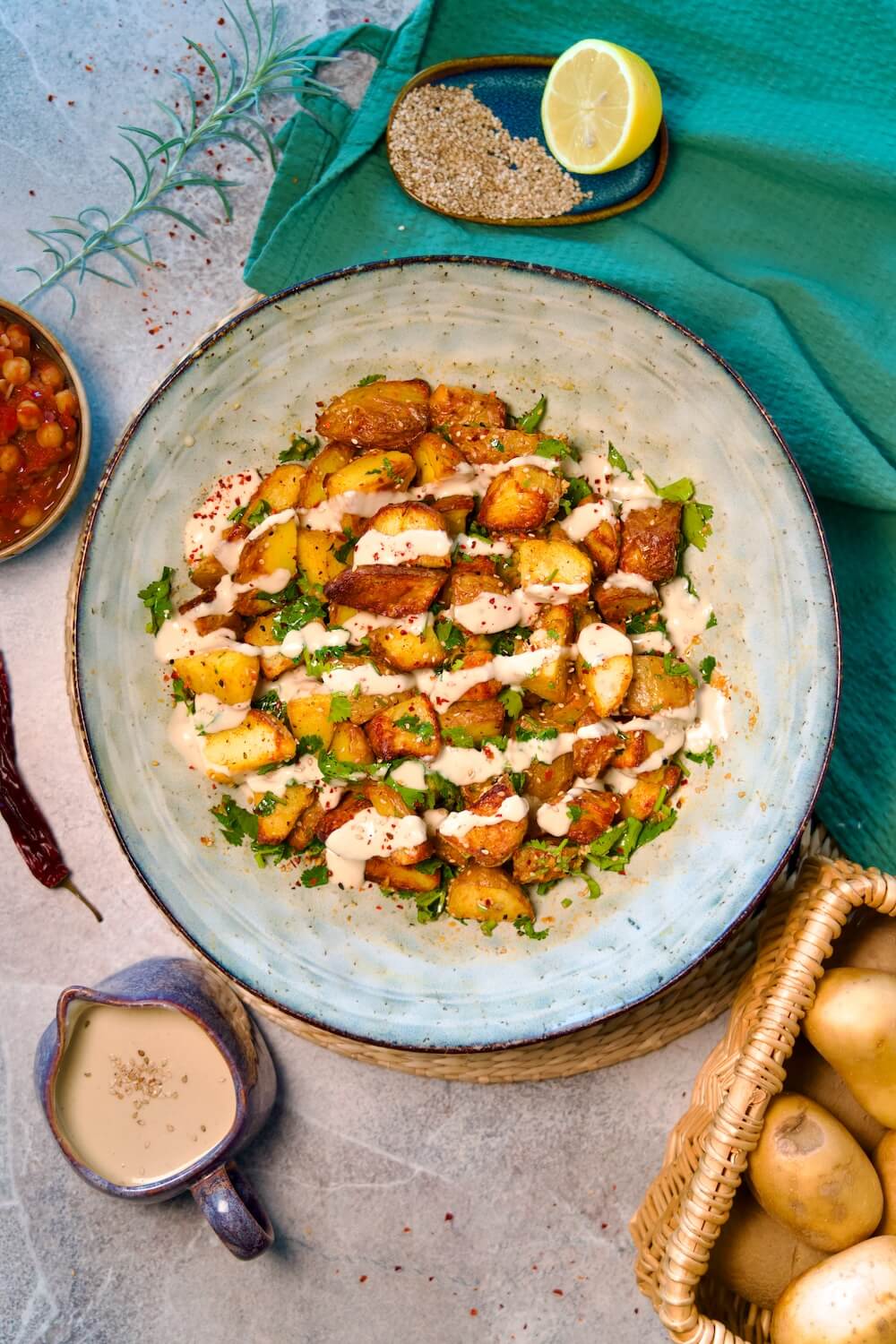 Finished Batata Harra in a Bowl with tahini sauce